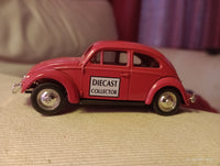 Lledo promotional diecast model of a red Volkswagen Beetle