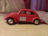 Lledo promotional diecast model of a red Volkswagen Beetle