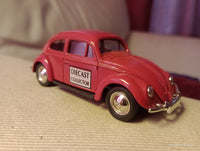 Lledo promotional diecast model of a red Volkswagen Beetle